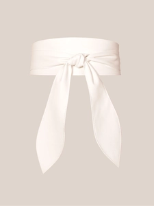Detail of white wide obi belt made of soft textured fabric with an elegant central knot