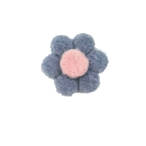 Handmade felt flower accessory in navy blue and pink for clothing and hair decorations