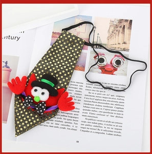 Detail of Halloween sequin pet tie featuring a red vampire design and elastic band