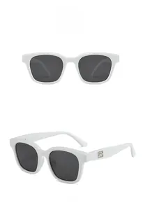 Detail of white acetate square sunglasses with silver metal logo on thick temples