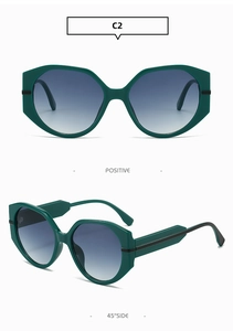 Détail de lunettes de soleil géométriques vert foncé avec verres dégradés bleus