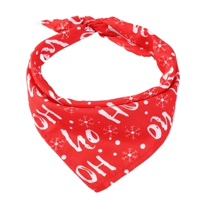 Detail of red Christmas pet bandana with HO HO HO text and white snowflake patterns