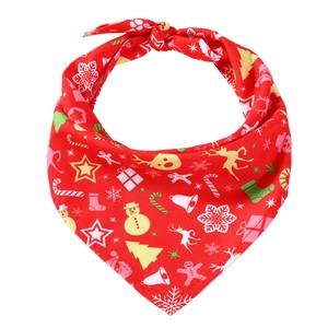 Detailed flat lay of red Christmas pet bandana featuring festive snowman and reindeer patterns