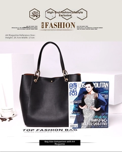 Black pebbled leather tote bag shown next to an A4 magazine for size comparison