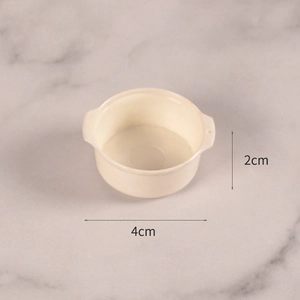 Close-up of a 4cm cream white miniature resin bowl with dual handles for DIY dollhouses