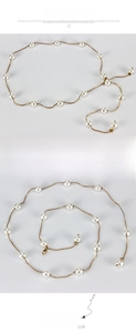 Close-up of thin gold snake chain belt with white pearls and lobster clasp closure