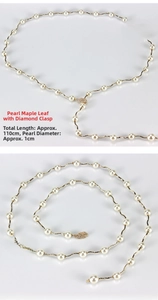 Detail of 110cm pearl waist chain with golden maple leaf buckle and rhinestone inlay