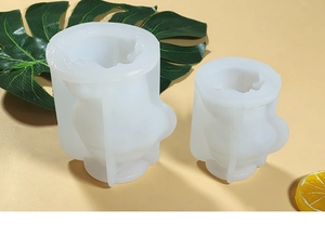 Detailed view of two translucent white silicone molds for DIY teddy dog ice or candles