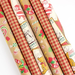 Christmas kraft wrapping paper rolls with vintage holiday patterns and red plaid design