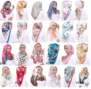 Collage of 24 colorful satin silk square scarves with geometric and floral patterns