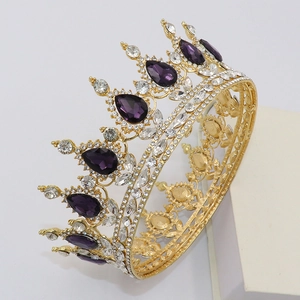 Detail of golden Baroque bridal crown featuring purple teardrop crystals and clear rhinestones