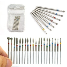 Detailed view of dental burs with diamond coating and color-coded shanks in various shapes