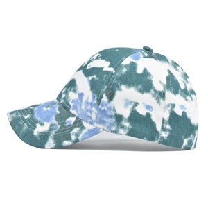 Detailed side view of tie-dye cotton ponytail sun visor showing blue cloud patterns
