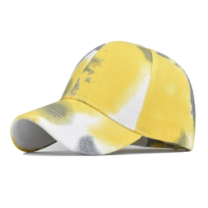 Detail of yellow and grey tie-dye cotton ponytail sun hat with reinforced brim stitching