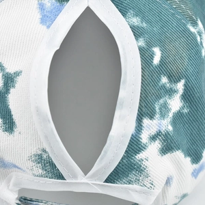 Macro view of functional ponytail opening with blue camouflage and star pattern cotton fabric