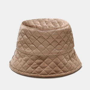 Detail of dark khaki velvet bucket hat with diamond quilted pattern and warm texture
