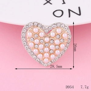 Macro detail of heart-shaped DIY craft charm with pearls and rhinestones 28.5x26mm