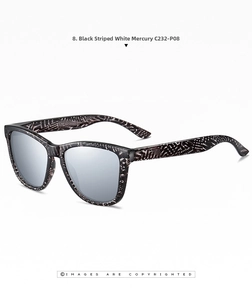 Detail of fashion sunglasses with black and white striped frames and silver mirror lenses
