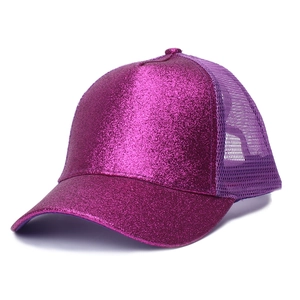 Detail of purple sequin baseball cap showing mesh back and glittery fabric texture