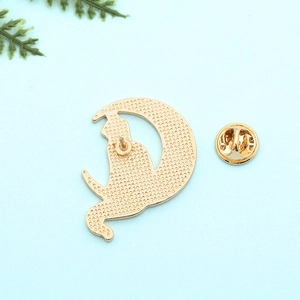Back view of a gold punk cat and moon alloy brooch with honeycomb texture and butterfly clasp