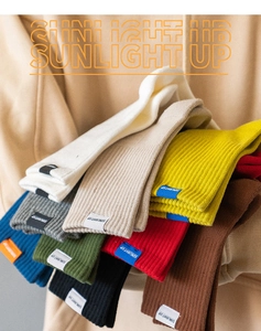 Close-up of colorful ribbed cotton crew socks in vibrant stacked shades of green, blue and red