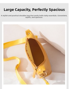 Detailed interior of yellow faux crocodile moon bag showing spacious storage capacity