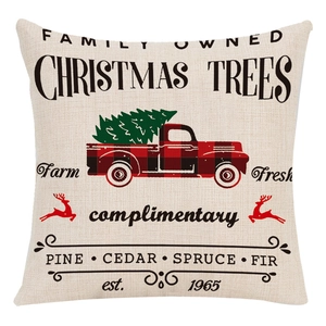 Close-up of linen blend Christmas cushion cover featuring vintage tree farm typography