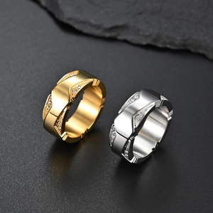 Close-up of classic gold and silver plated stainless steel rings with diamond accents