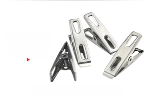 Detail view of four stainless steel flat clips with eco-friendly rivetless spring design