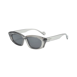 Modern cat-eye sunglasses with translucent gray frames and dark lenses at a 45-degree angle