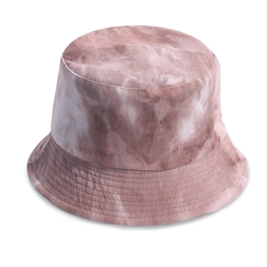 Close-up of pink tie-dye corduroy fabric texture and fine stitching on the bucket hat