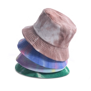 Tie-dye corduroy bucket hats for women in multiple colors stacked on white background