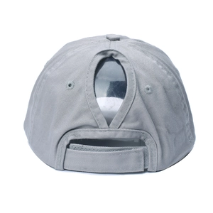Detail of light gray cotton ponytail baseball cap featuring back opening and velcro strap