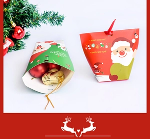 Detail of Christmas gift boxes with Santa and Snowman prints in red and green colors
