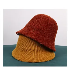 Solid color chenille knit bucket hats in reddish brown and ginger yellow for autumn