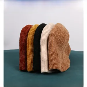 Close-up of chenille knitted bucket hats showing ribbed texture in five diverse colors
