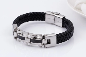 Detail of men's leather braided bracelet with carbon fiber and stainless steel accents