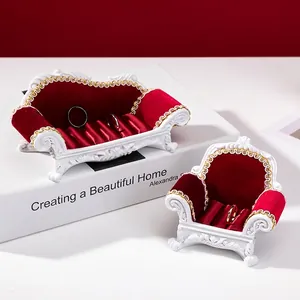 Miniature sofa jewelry displays in white resin and red velvet for rings and earrings