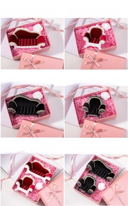 Macro shot of sofa-shaped jewelry boxes in red and black with luxury gift packaging