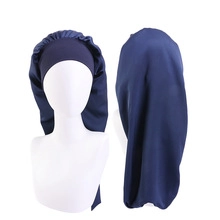 Detailed front and back views of a dark blue satin sleep cap on a mannequin head