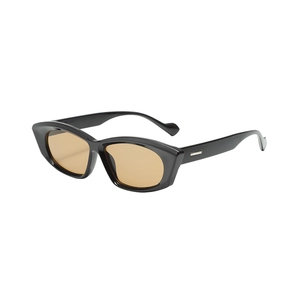Chic cat eye sunglasses with black frame, amber lenses and silver metal temple accents