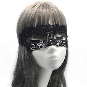 Detailed close-up of a black lace masquerade mask on a mannequin for adult party events