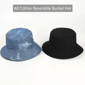 Reversible 100% cotton bucket hat in denim blue marble tie-dye and solid black