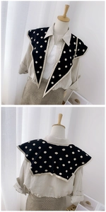Front and back detail of a black knitted fake collar with white polka dots
