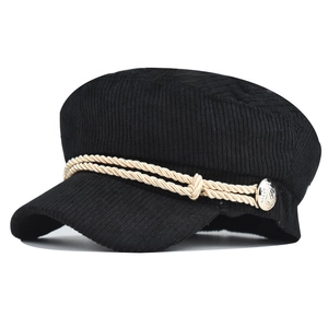 Detail of black corduroy newsboy cap with white twisted rope and vintage silver button