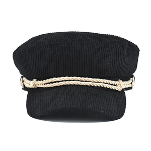 Close-up of black corduroy baker boy hat featuring golden braided rope and metal buttons