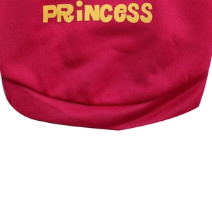 Detail of pink cotton pet vest showing yellow PRINCESS print and knit fabric texture