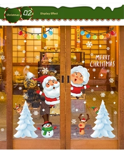 Christmas Santa and snowman static window stickers on a wooden glass door for festive decor