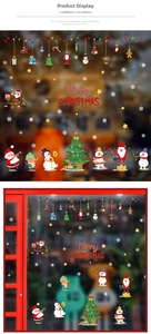 Detail of Santa and snowman window stickers with Merry Christmas text for holiday decor