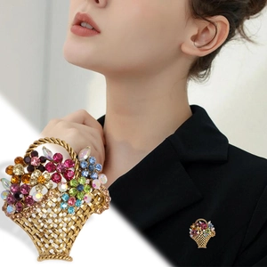 Charming golden flower basket brooch with colorful rhinestones on black blazer
